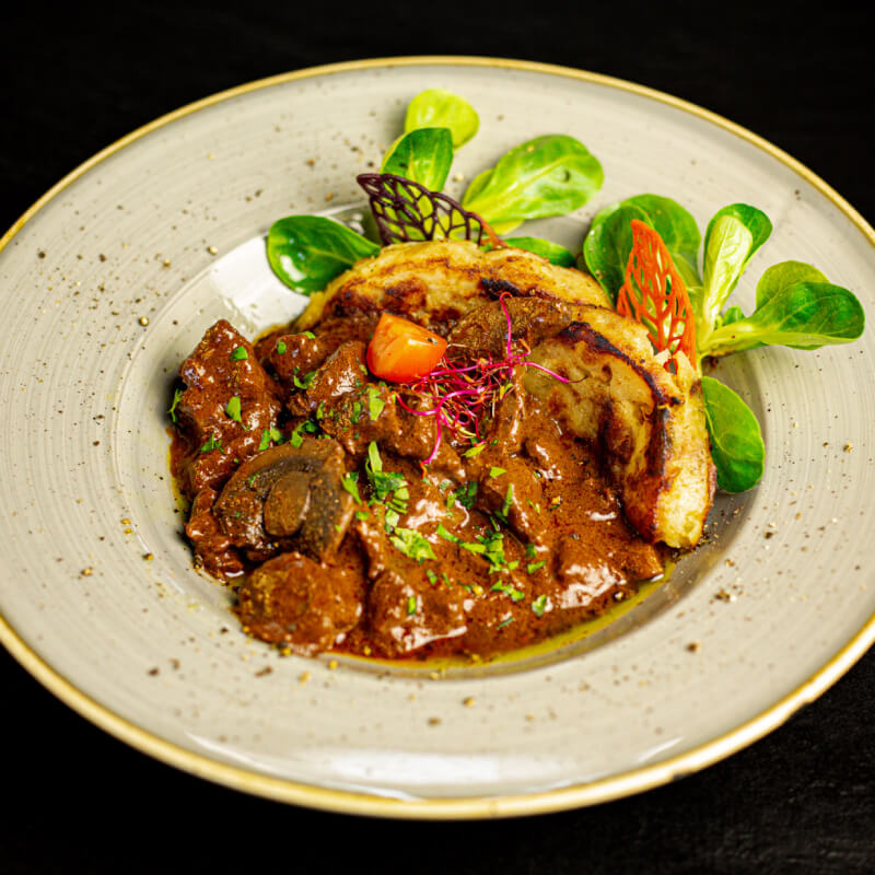 Beef ragout made with dark beer, mushroom and dark chocolate with bread dumpling (1)