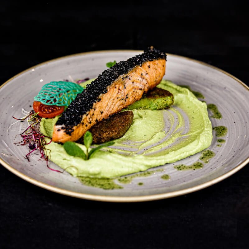 Black sesame crusted salmon steak with chili-mint pea purée and pea fritte (1)